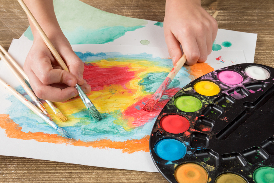 Child Painting with Paintbrush